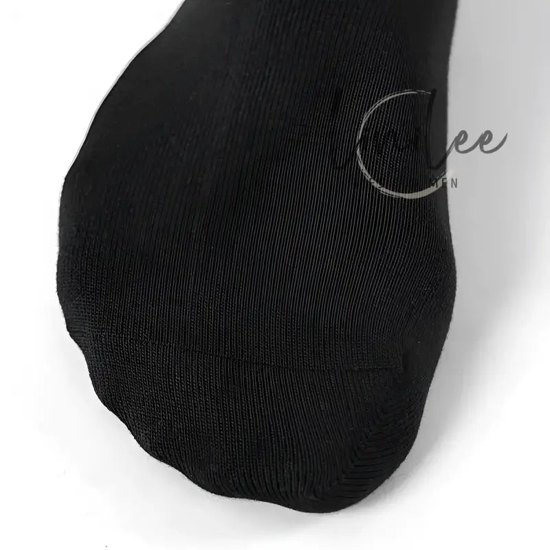 Black sock toe.