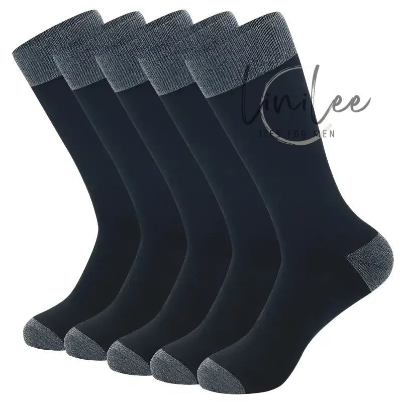 Six black socks with gray cuffs and heels.
