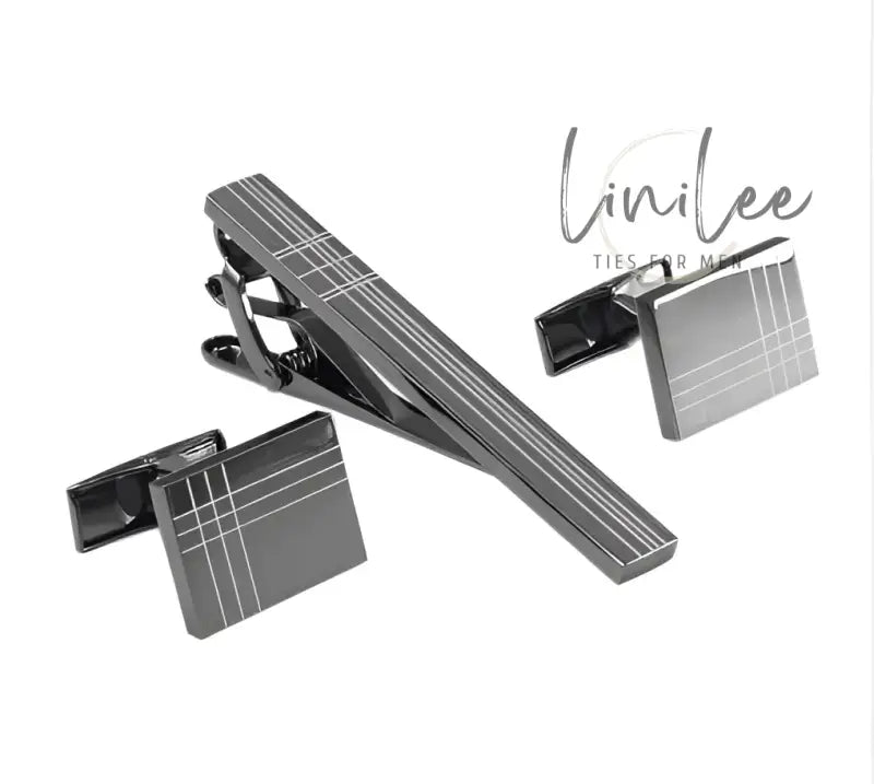 Gunmetal tie clip and cufflinks set.