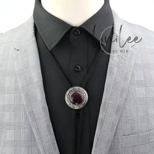 Bolo tie with a dark purple stone.
