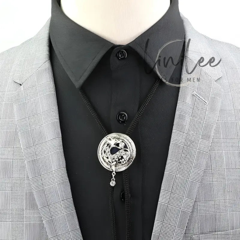 Gray plaid suit with bolo tie.