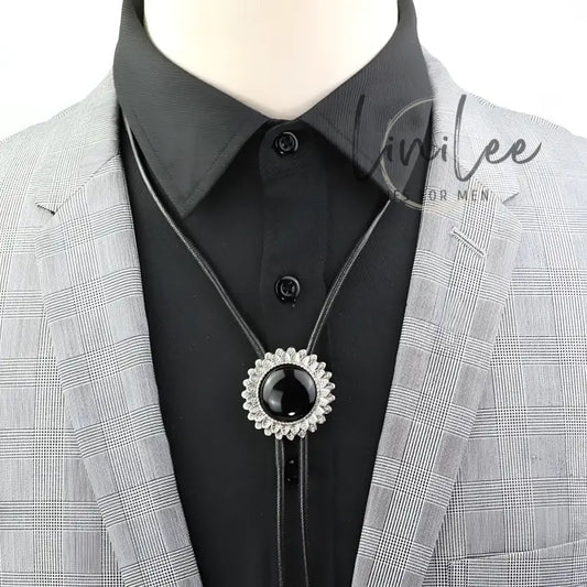 Black bolo tie with silver accents.