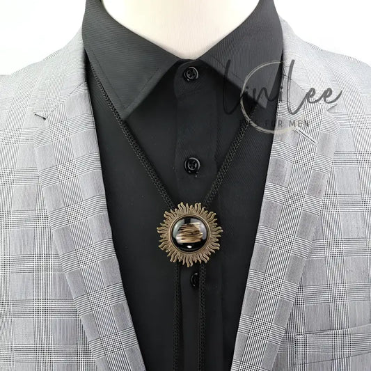Bolo tie with sunburst pendant.