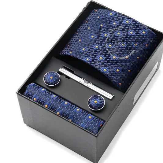 Navy blue tie set in a black box.