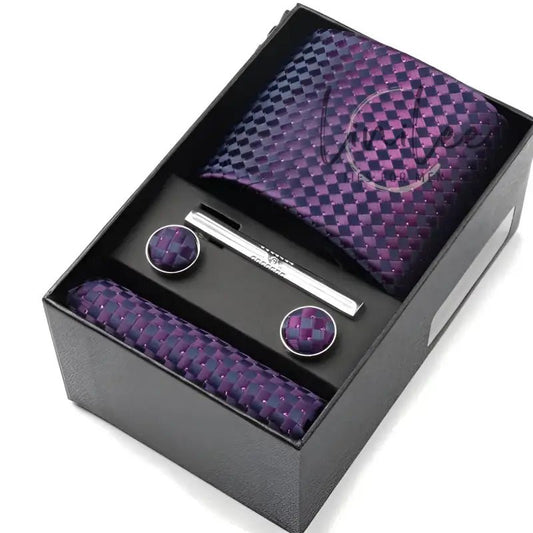 Men’s tie, pocket square, tie clip, and cufflink set.