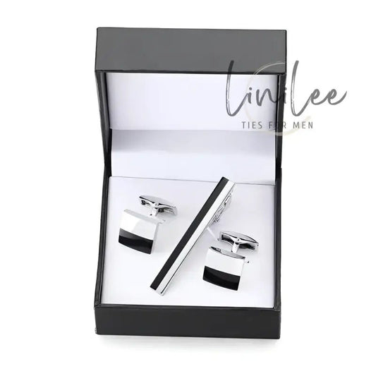Cufflink and tie clip set in a black box.