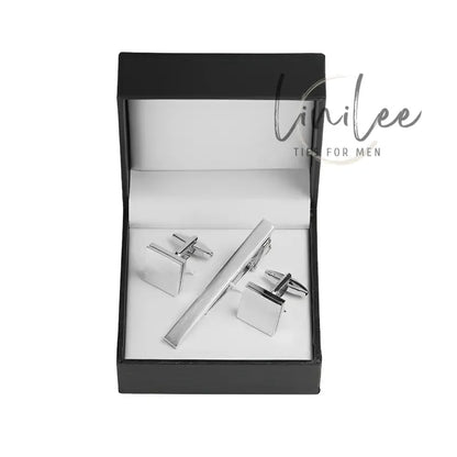 Cufflinks and tie clip set in a box.