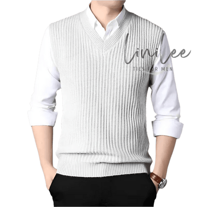 Man wearing a white shirt and a gray sweater vest.