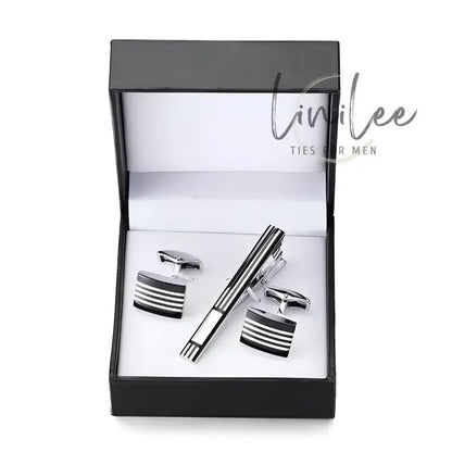 Cufflink and tie clip set in a black box.