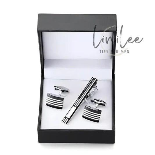 Cufflink and tie clip set in a black box.