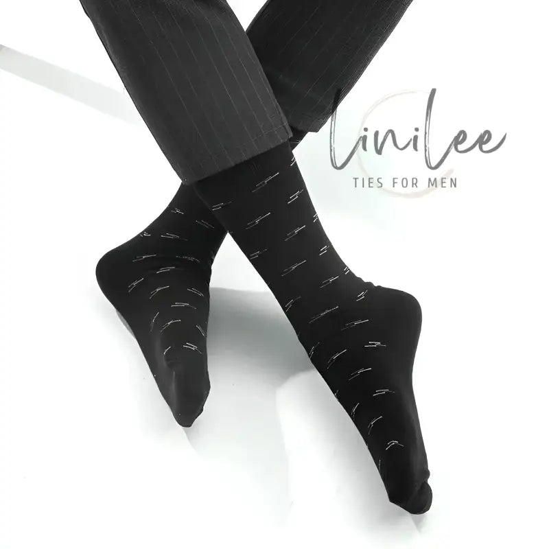 Black dress socks with silver accents.