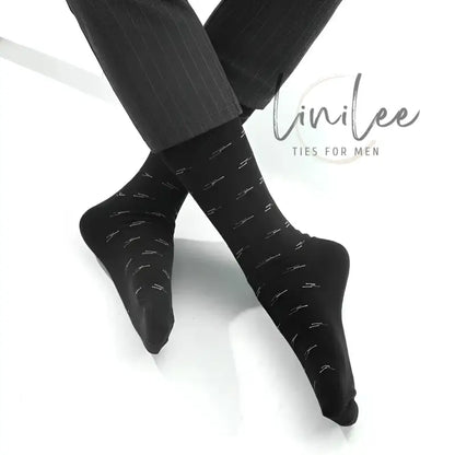 Black dress socks with silver accents.