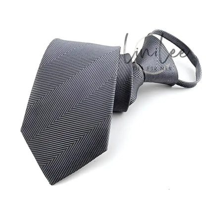 Gray herringbone clip-on tie.