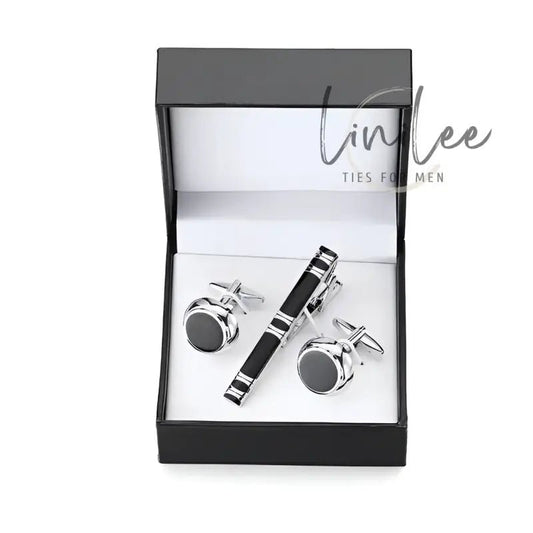 Cufflink and tie clip set in a black box.