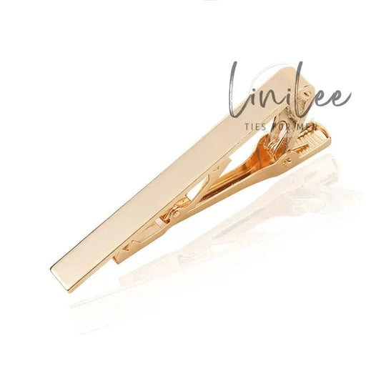 Gold-colored tie clip.